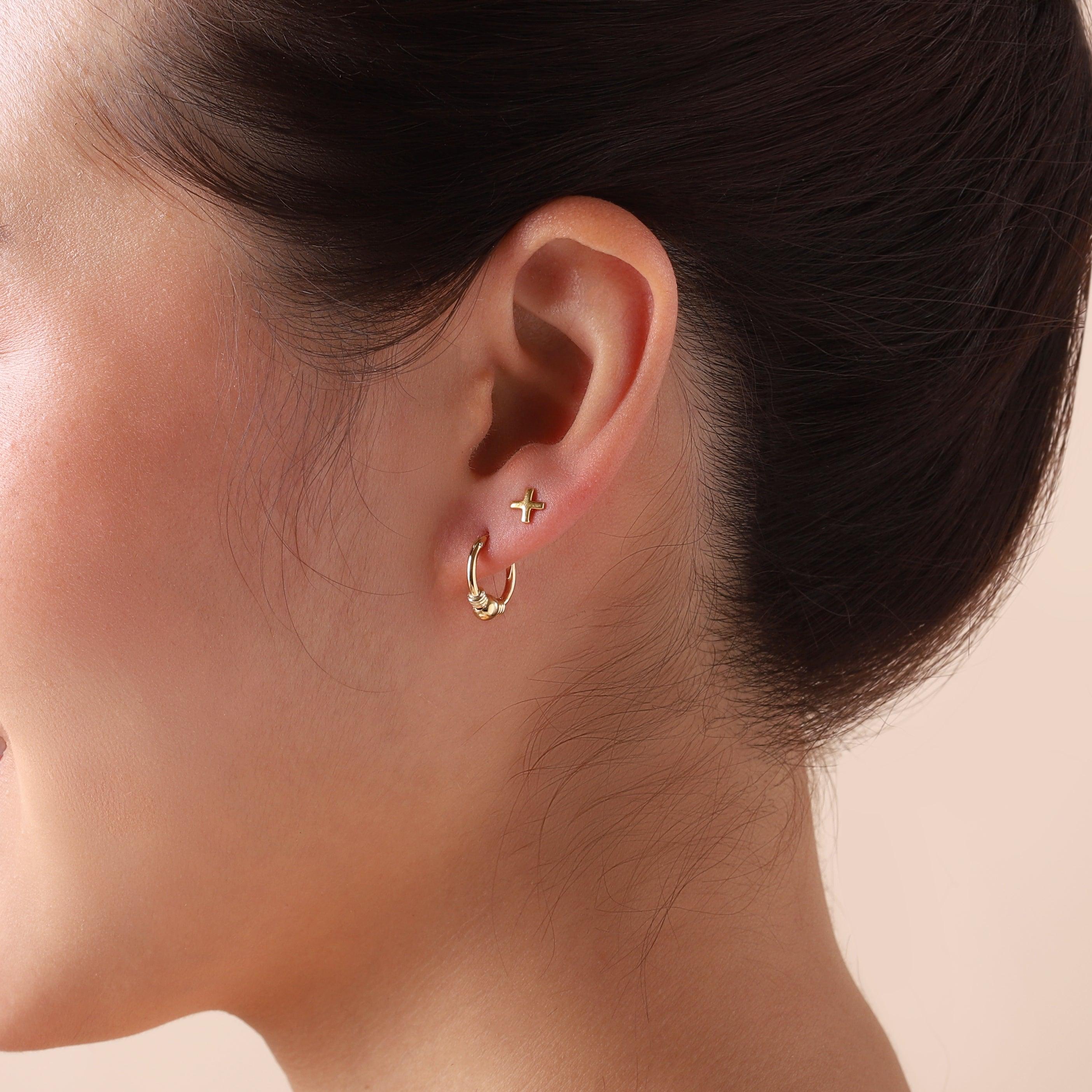 small gold plated bali hoop earrings on model