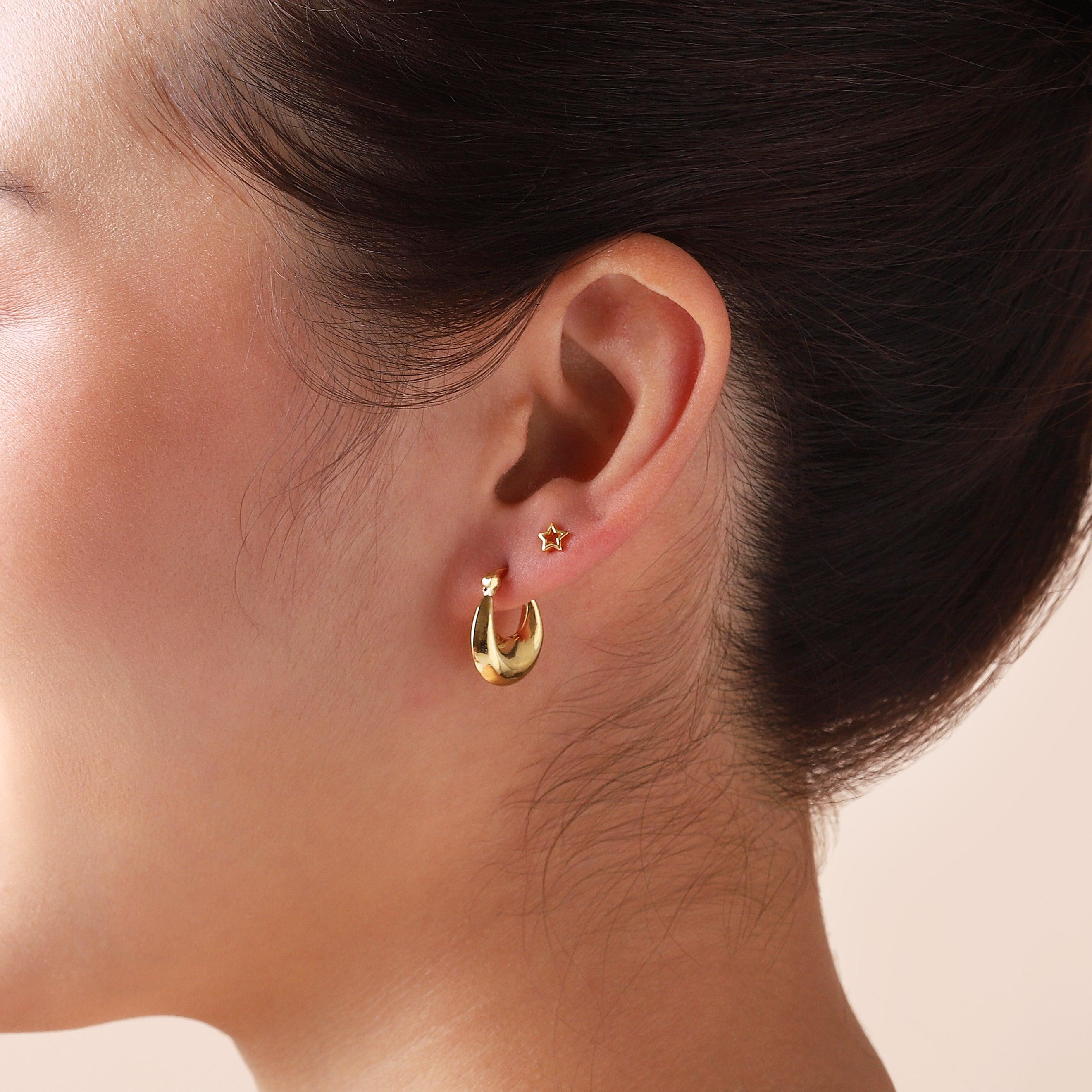 small gold plated droplet hoop earrings on model
