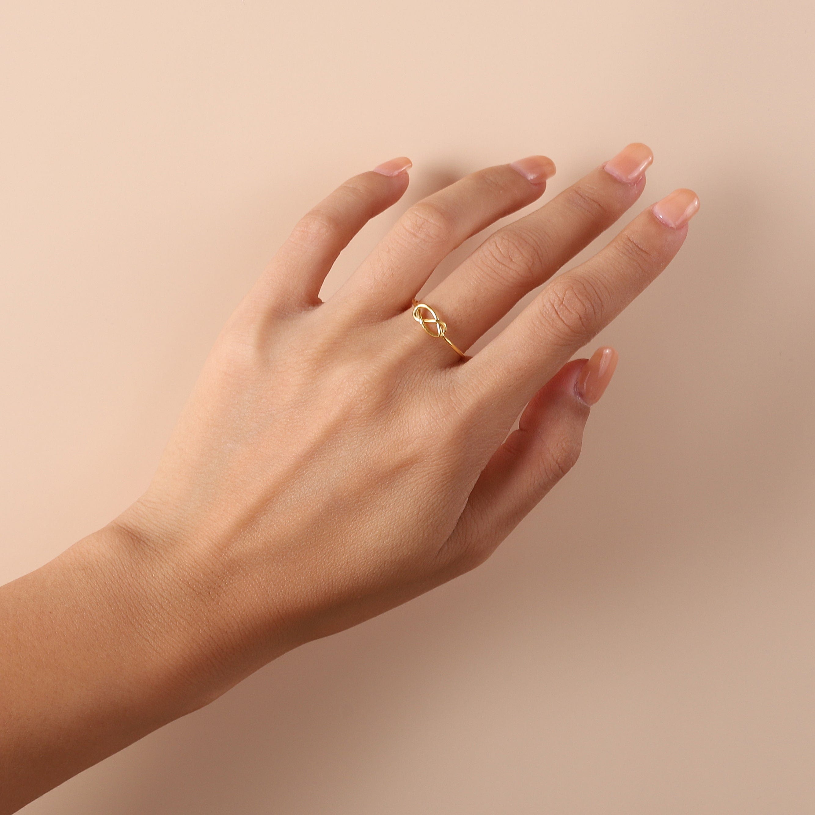 gold plated knot ring on model
