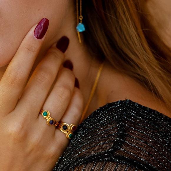 gold plated braided ring with green onyx on model