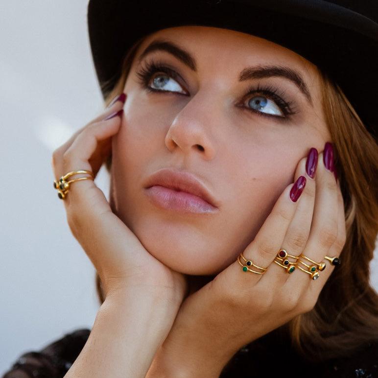 model with gemstone earrings