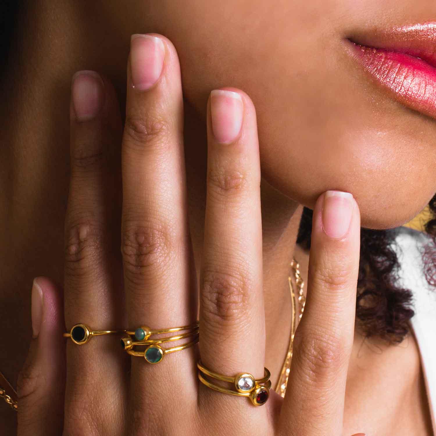 gemstones rings gold plated on hand model