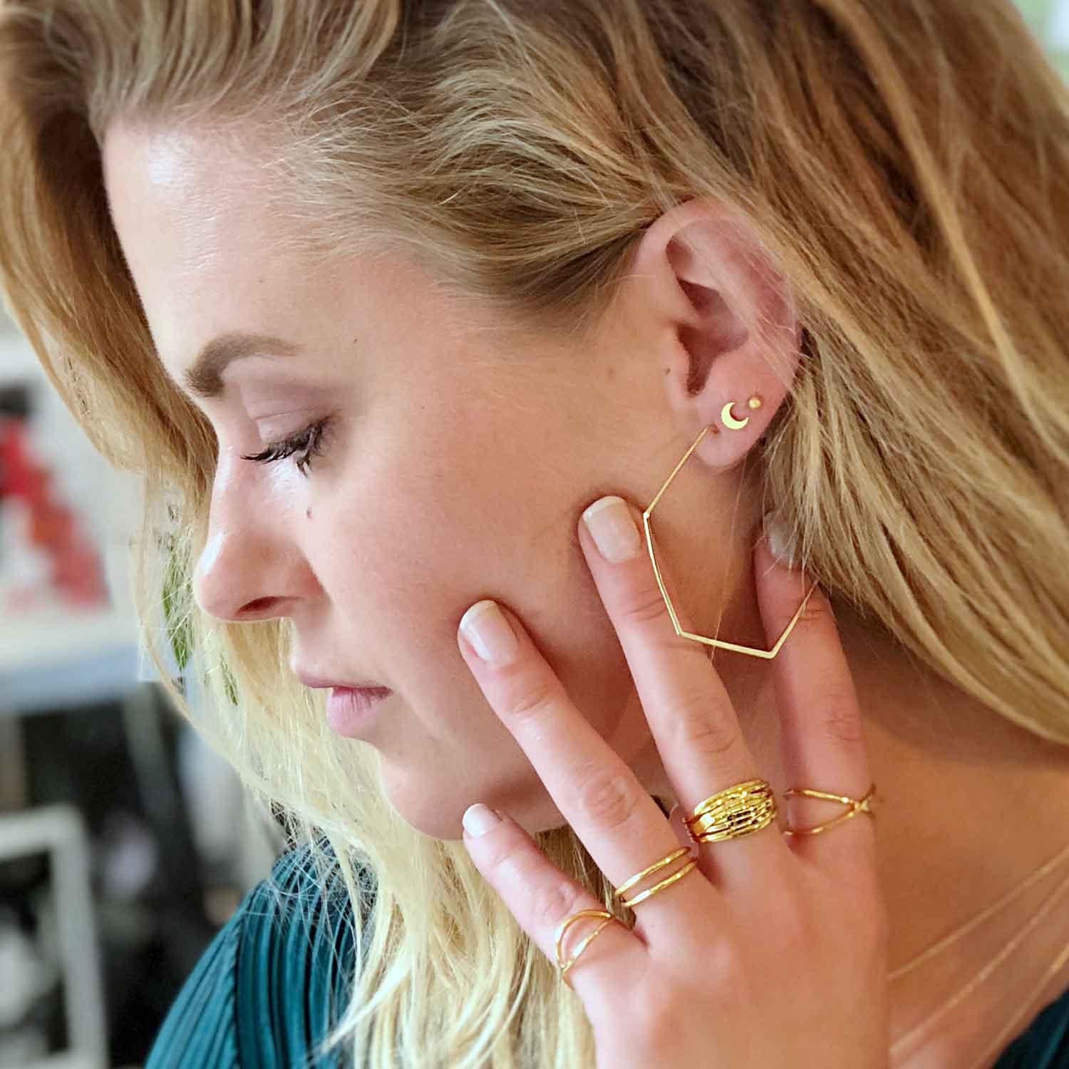 girl with gold plated moon stud earring