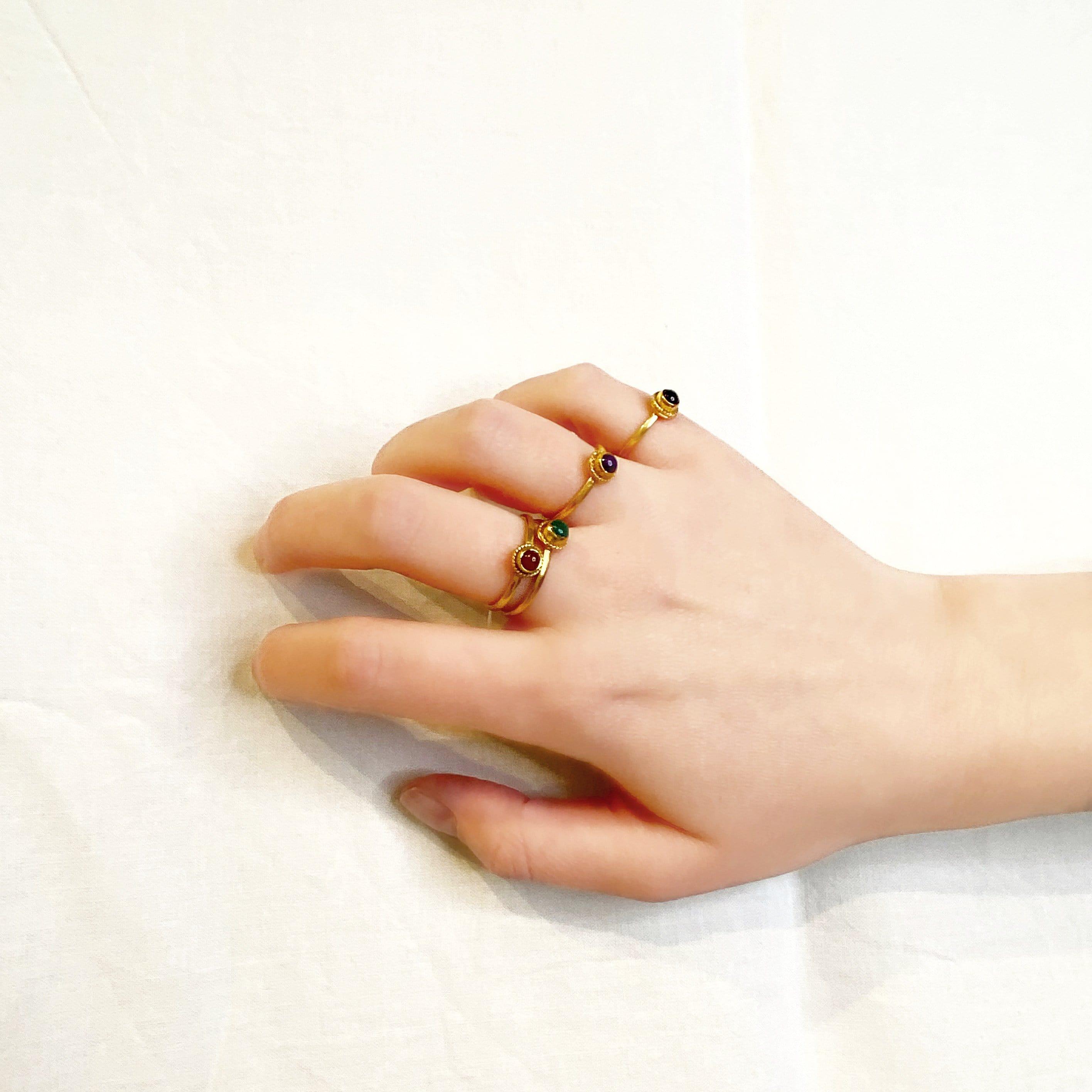 gold plated braided ring with amethyst on hand model