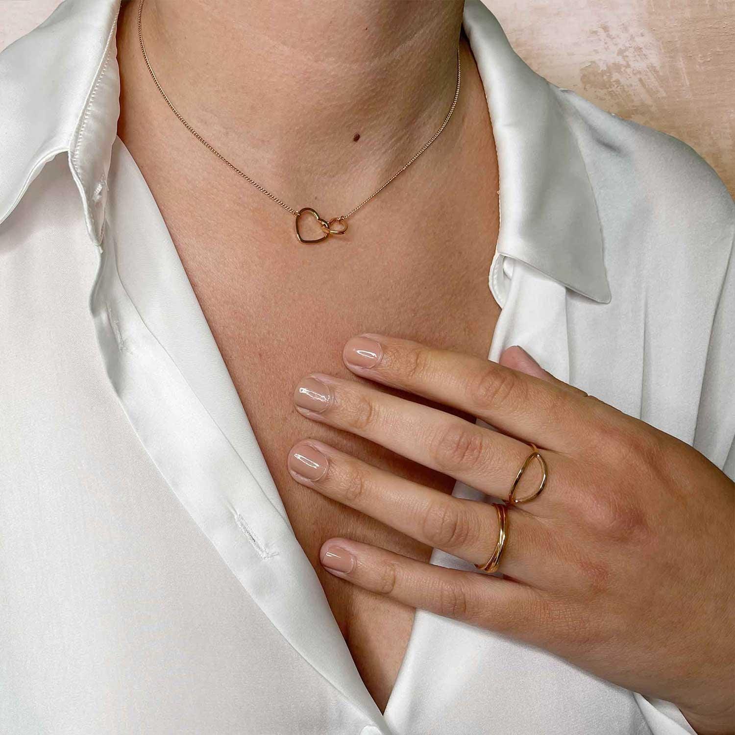 hand model with gold plated oval ring
