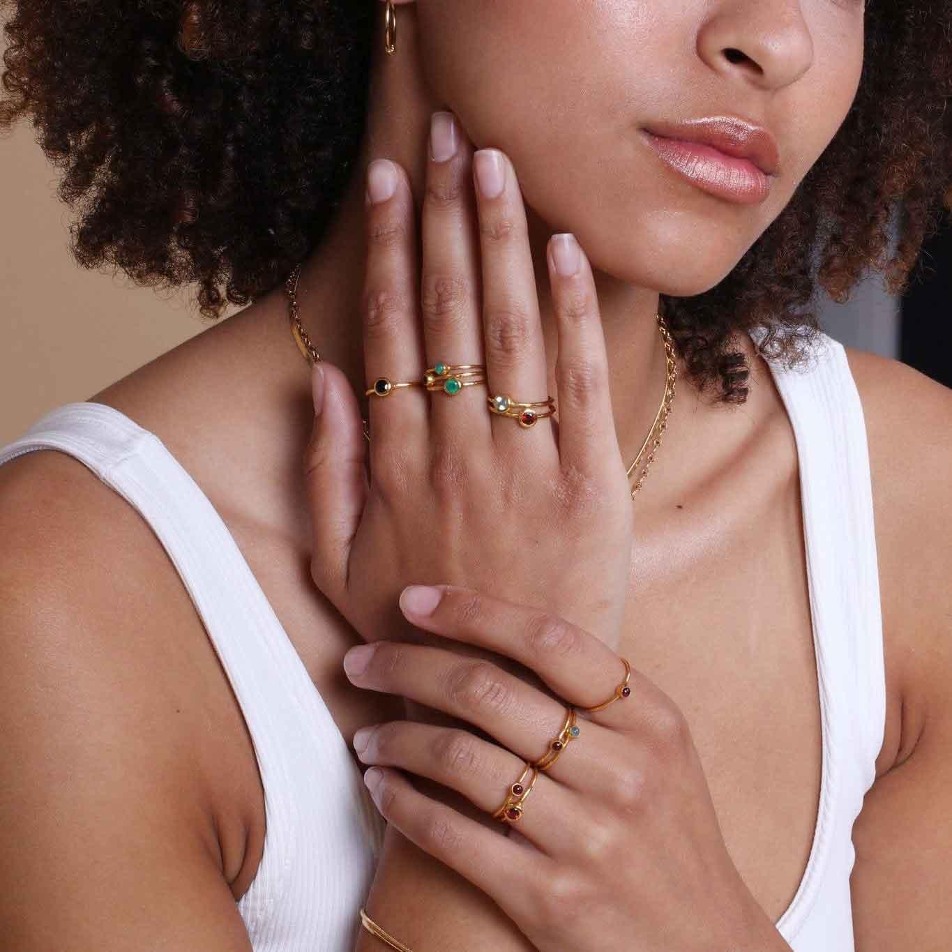 model with garnet ring