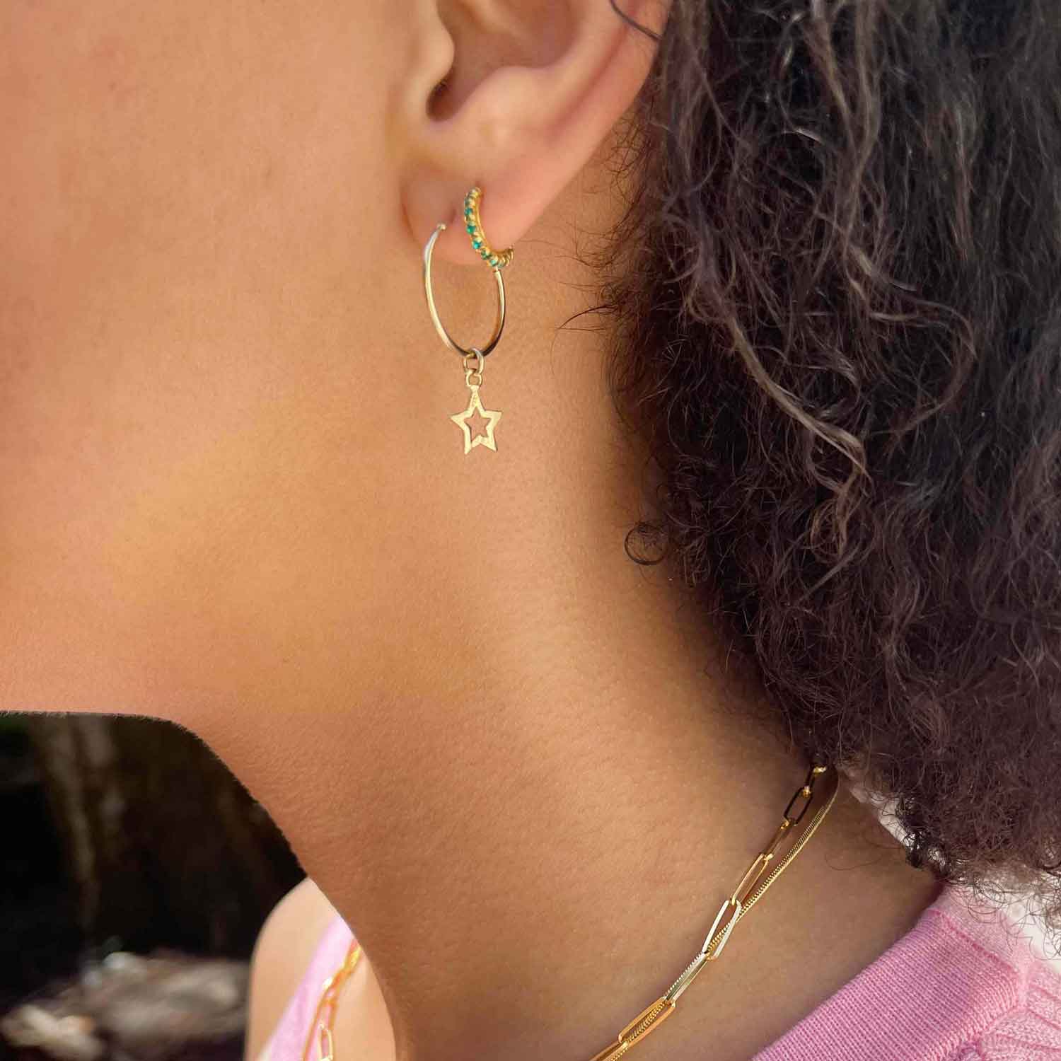 model with green stone hoop gold plated