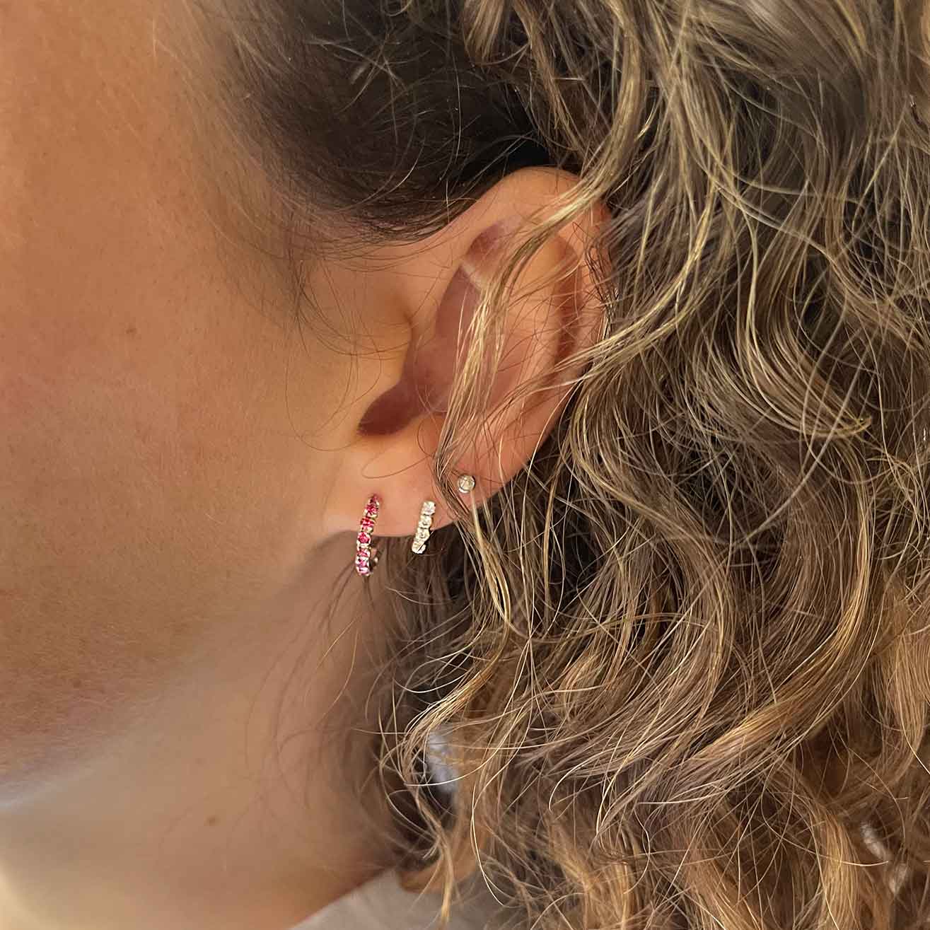 model with silver rose quartz hoop ear stud