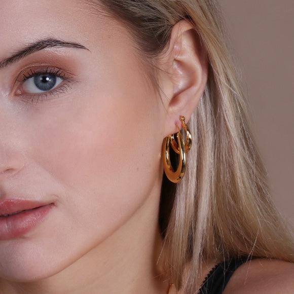 model with gold plated Oval Bold Indian Hoop Earrings