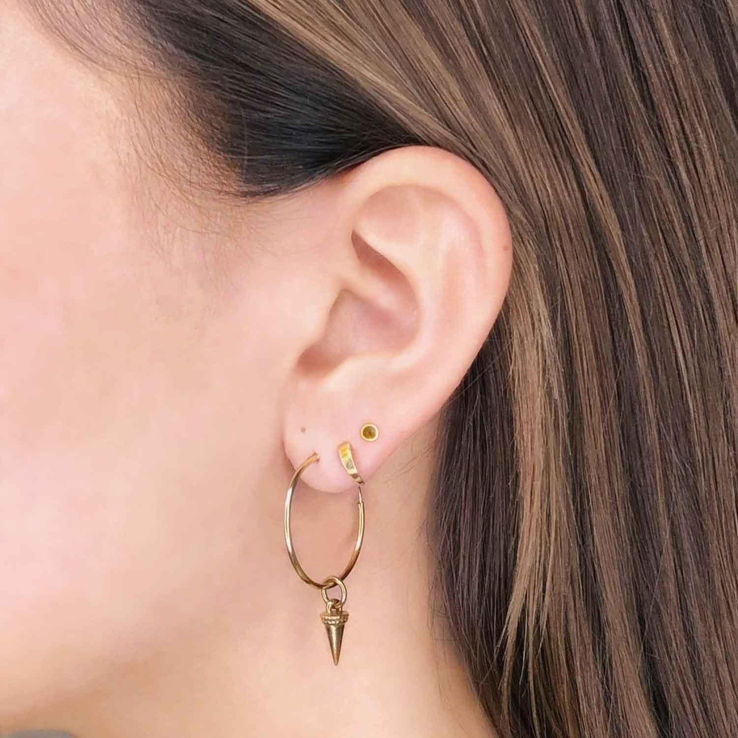 girl with mini gold plated ear stud on model
