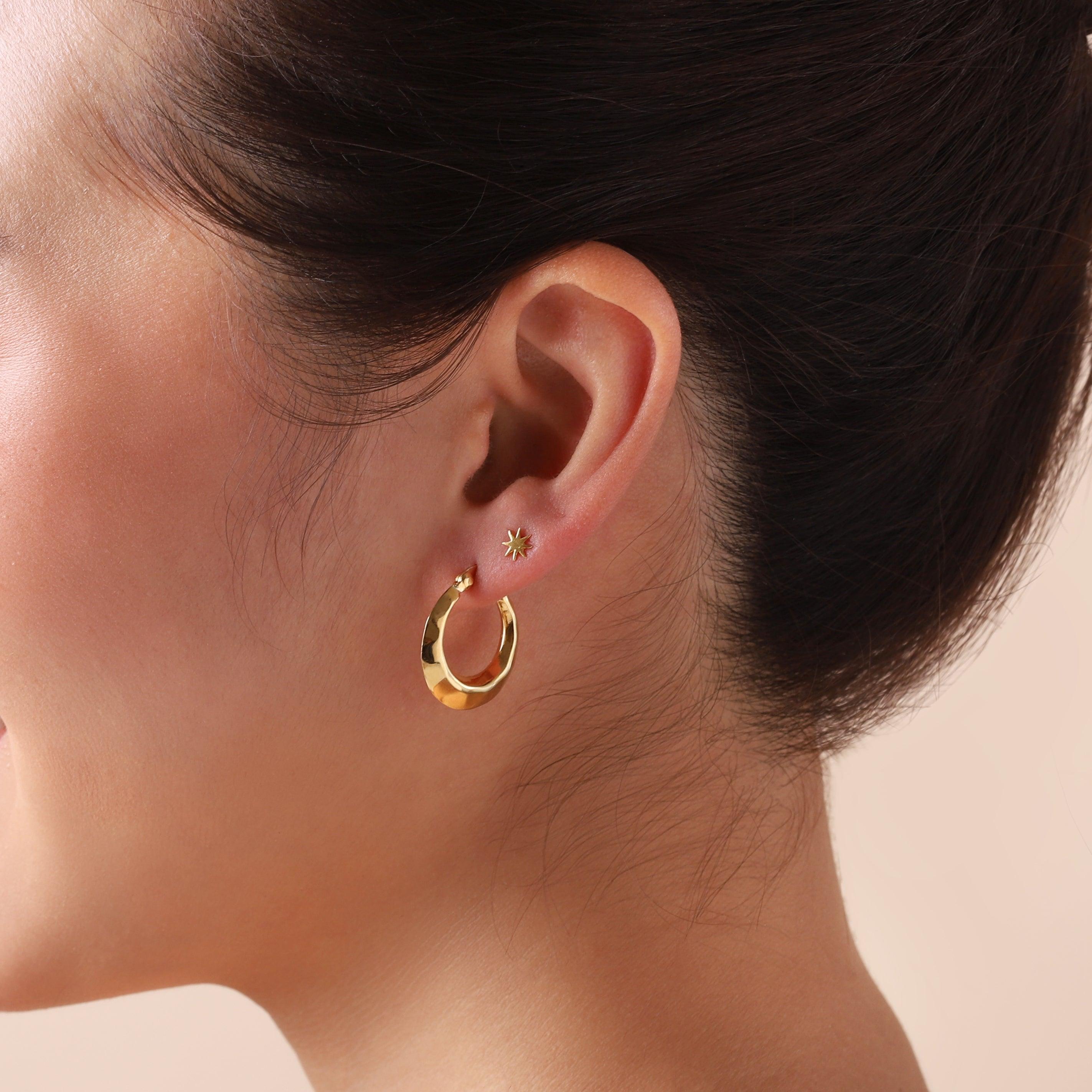 gold plated hammered hoop earrings on model