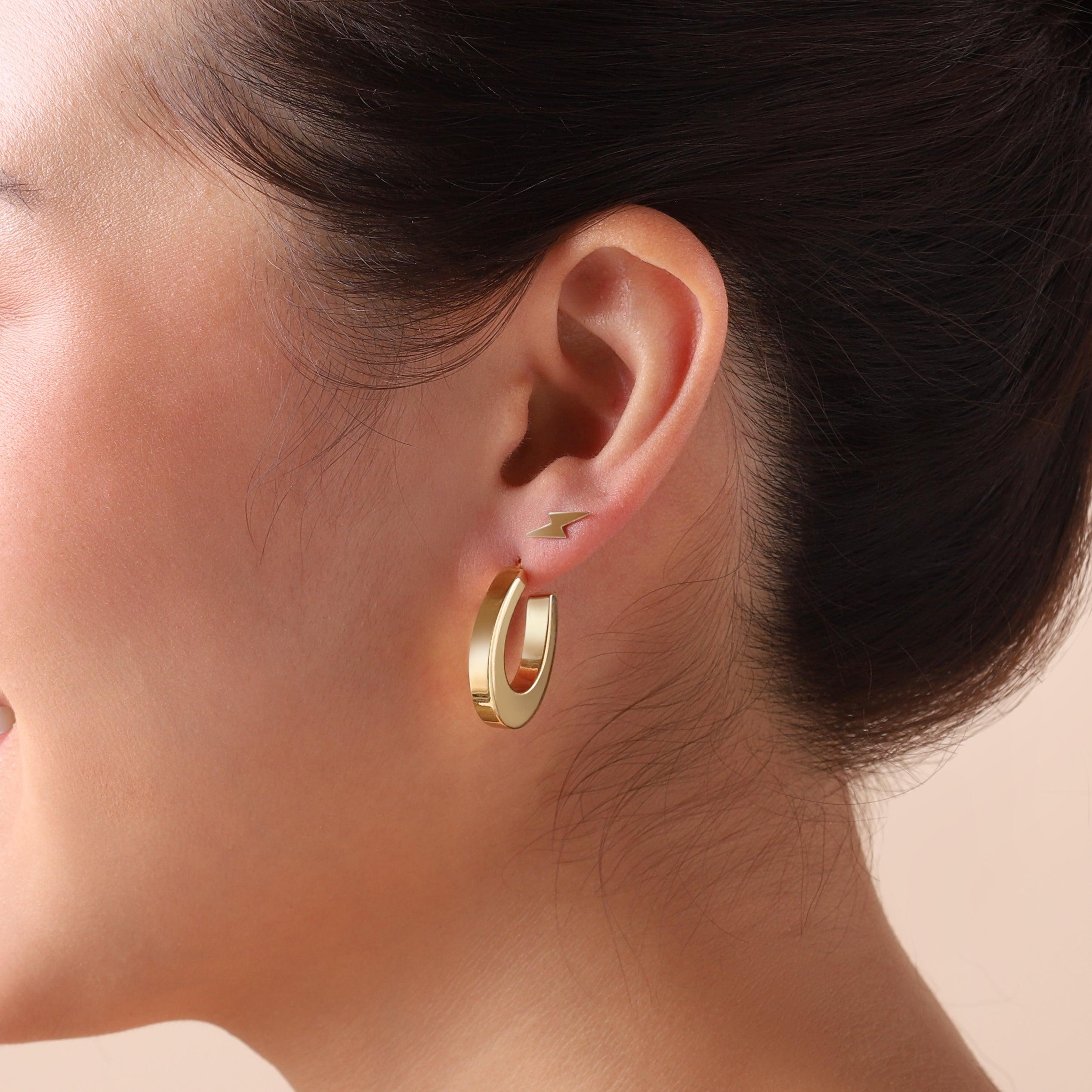 gold plated oval hoop earrings on model