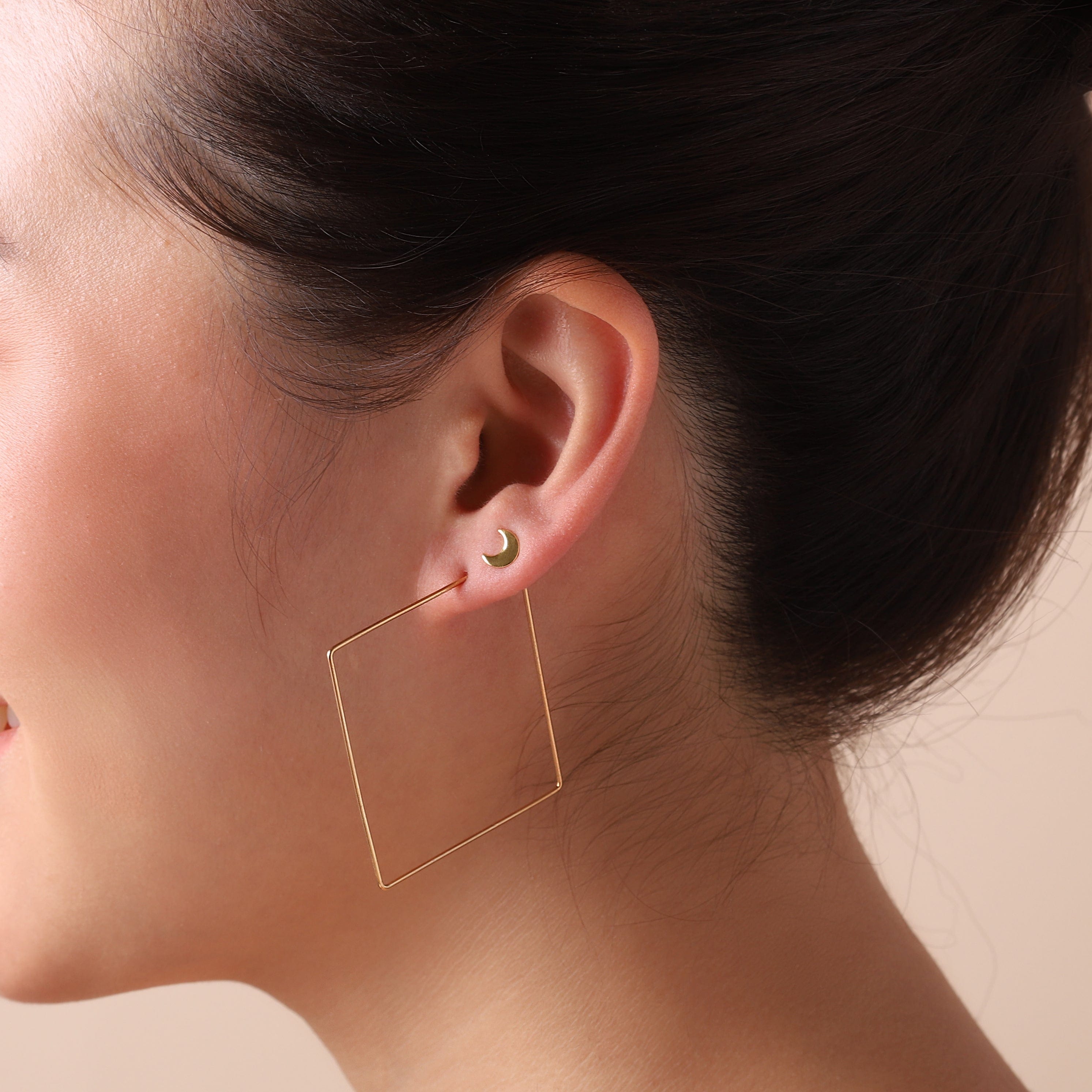 big gold plated square hoop earrings on model