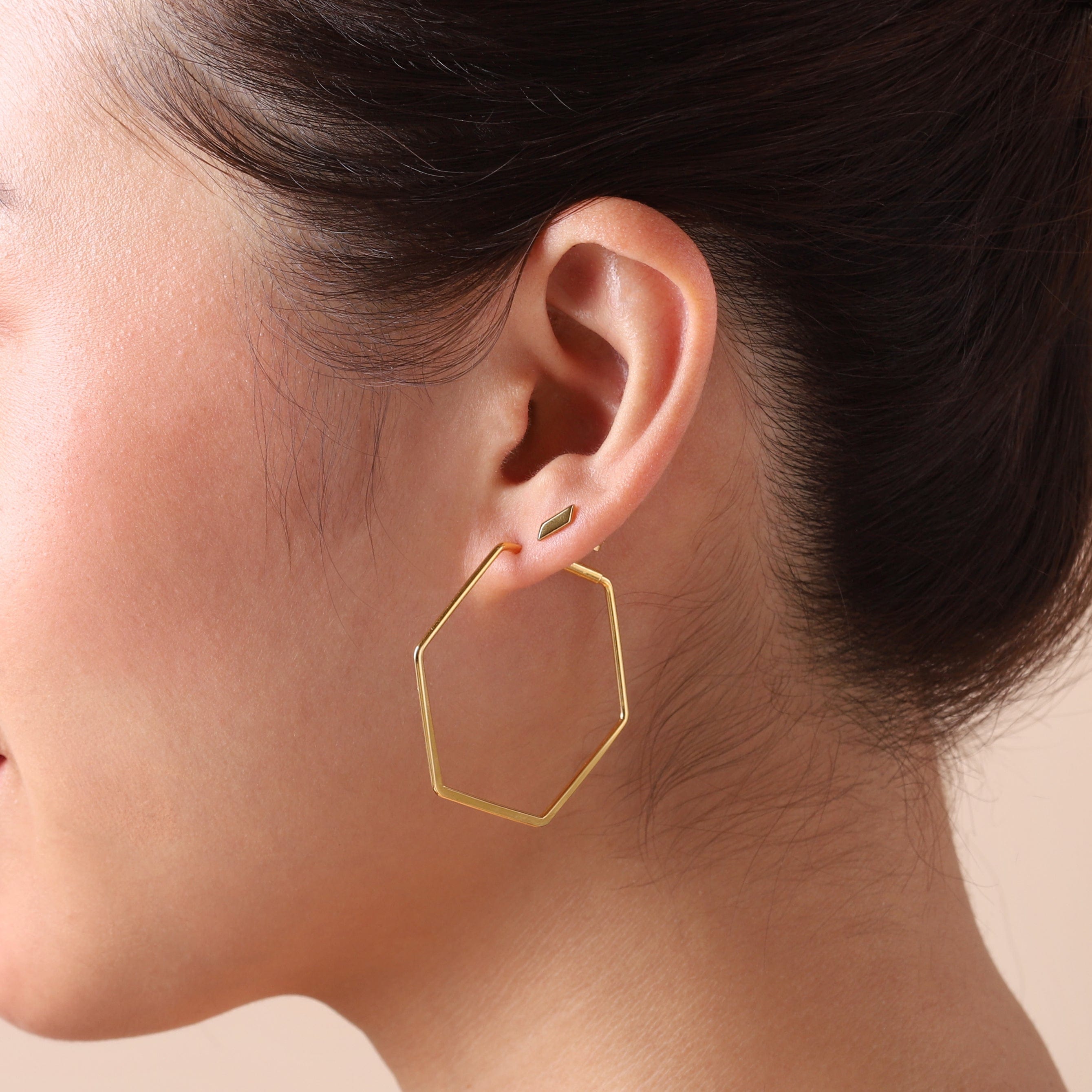 small gold plated hexagon hoop on model