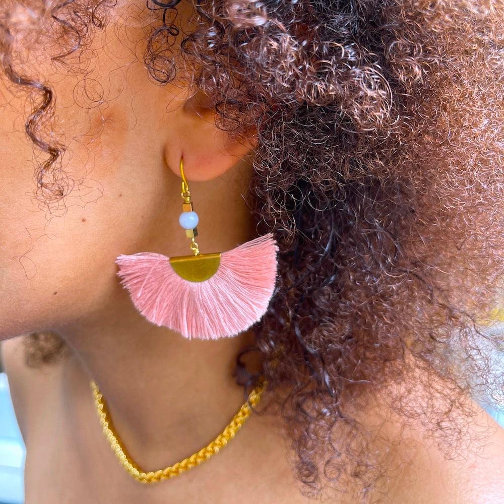 model with rose fan tassel earrings