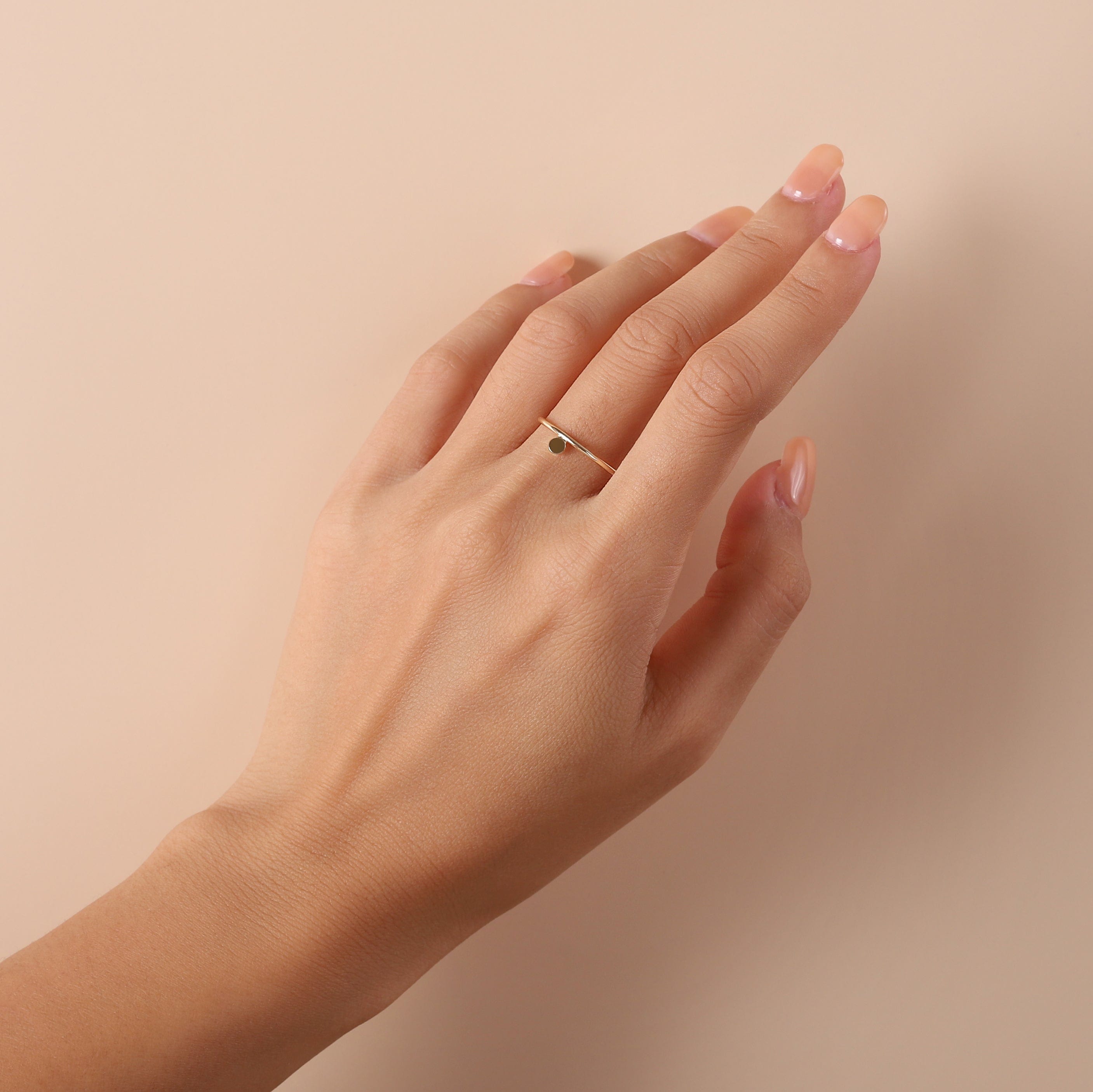 gold plated floating round ring on hand model