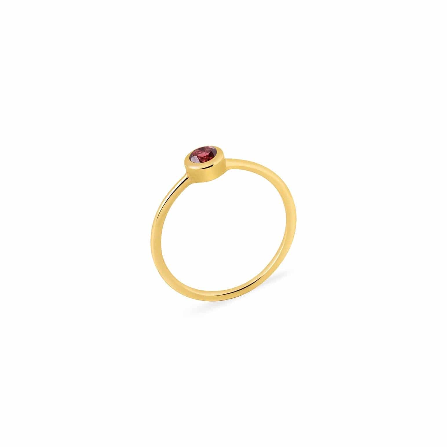 gold plated ring with red garnet