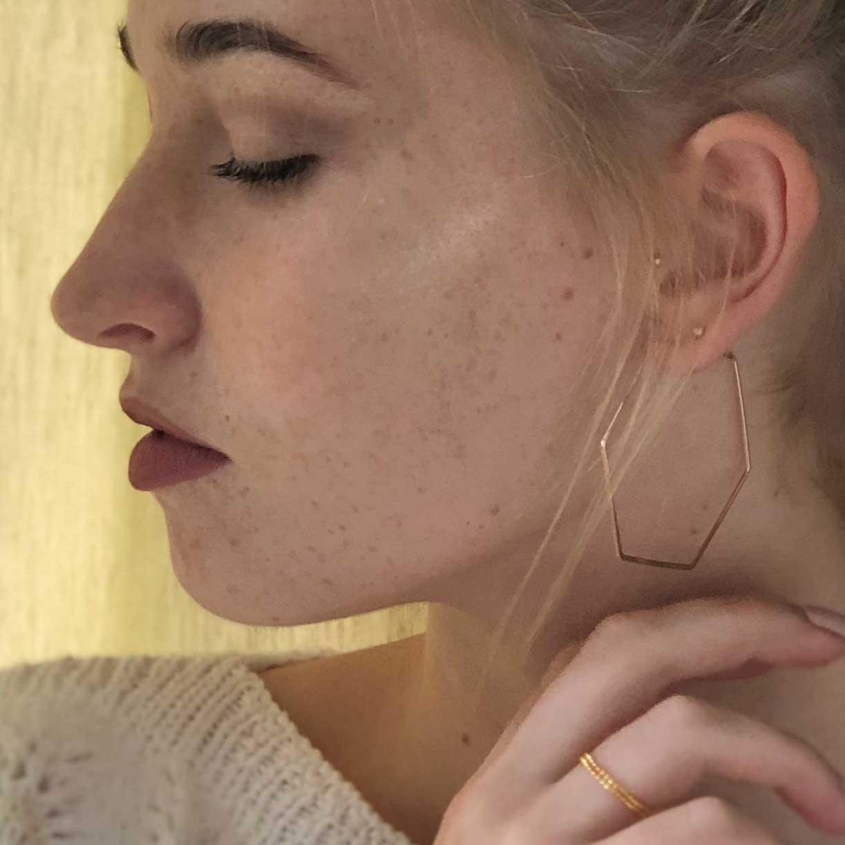 model with Big Rose Gold Plated Hexagon Hoop Earrings