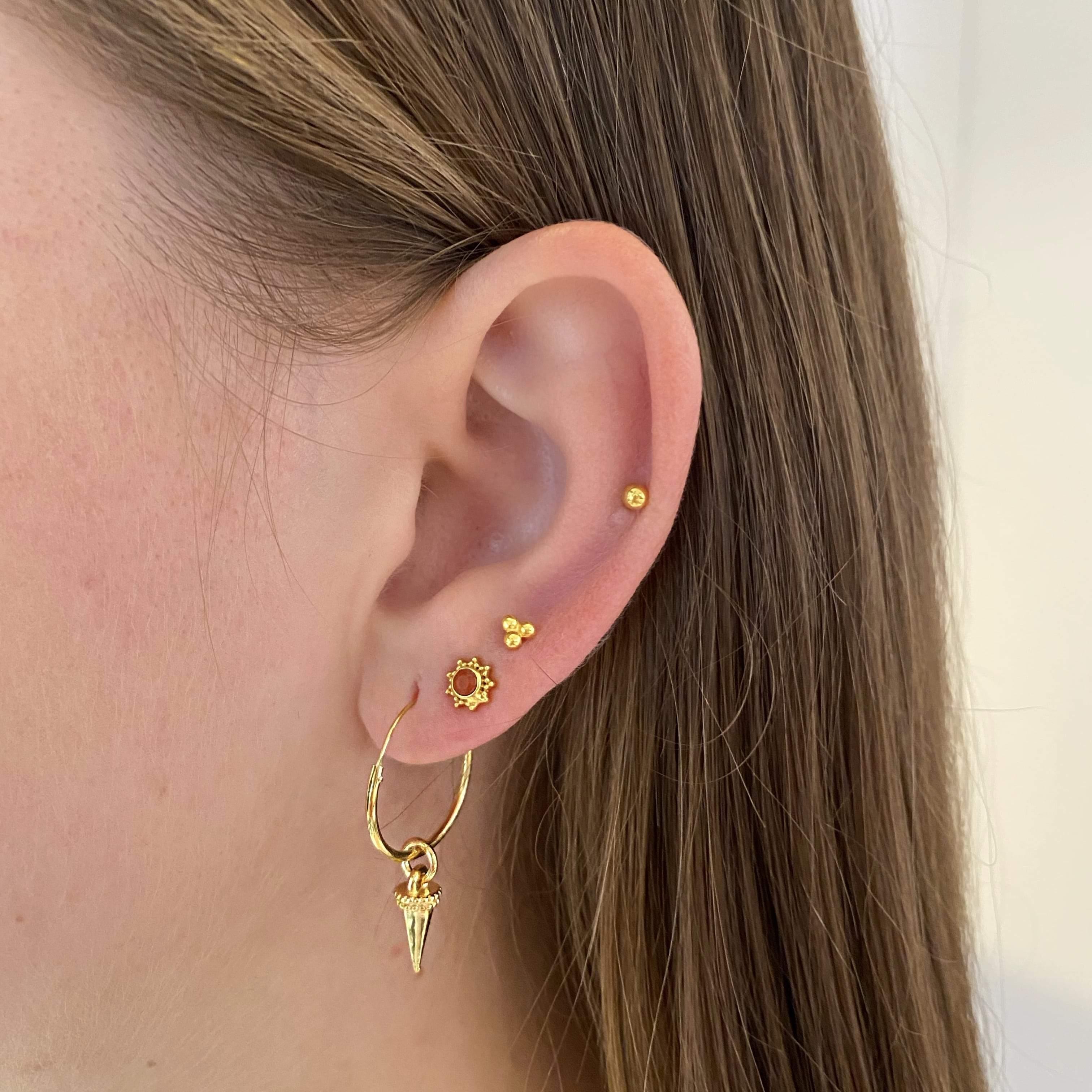 girl with gold plated Triple Stud Earrings