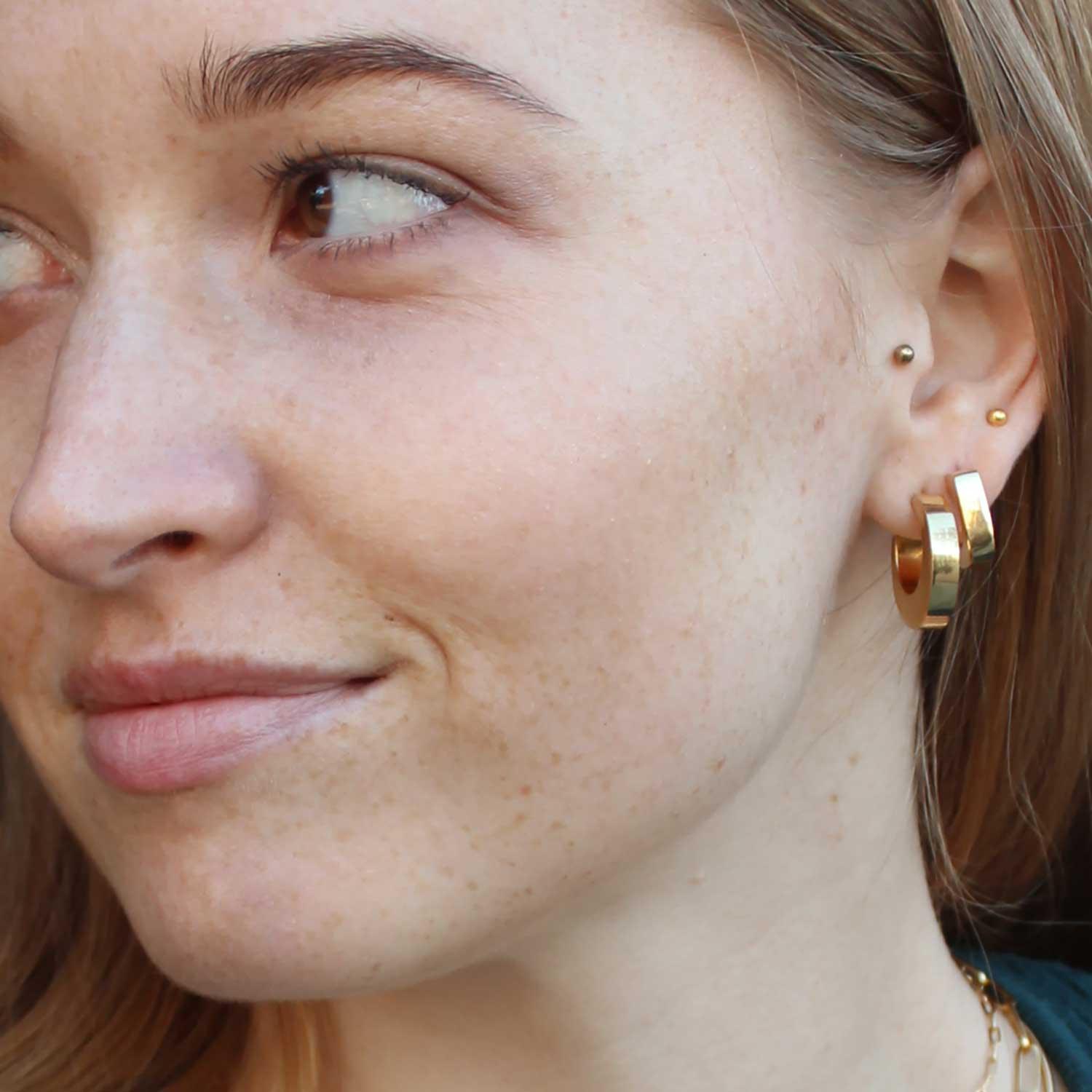 model with Gold Plated Indian C Hoop Earrings