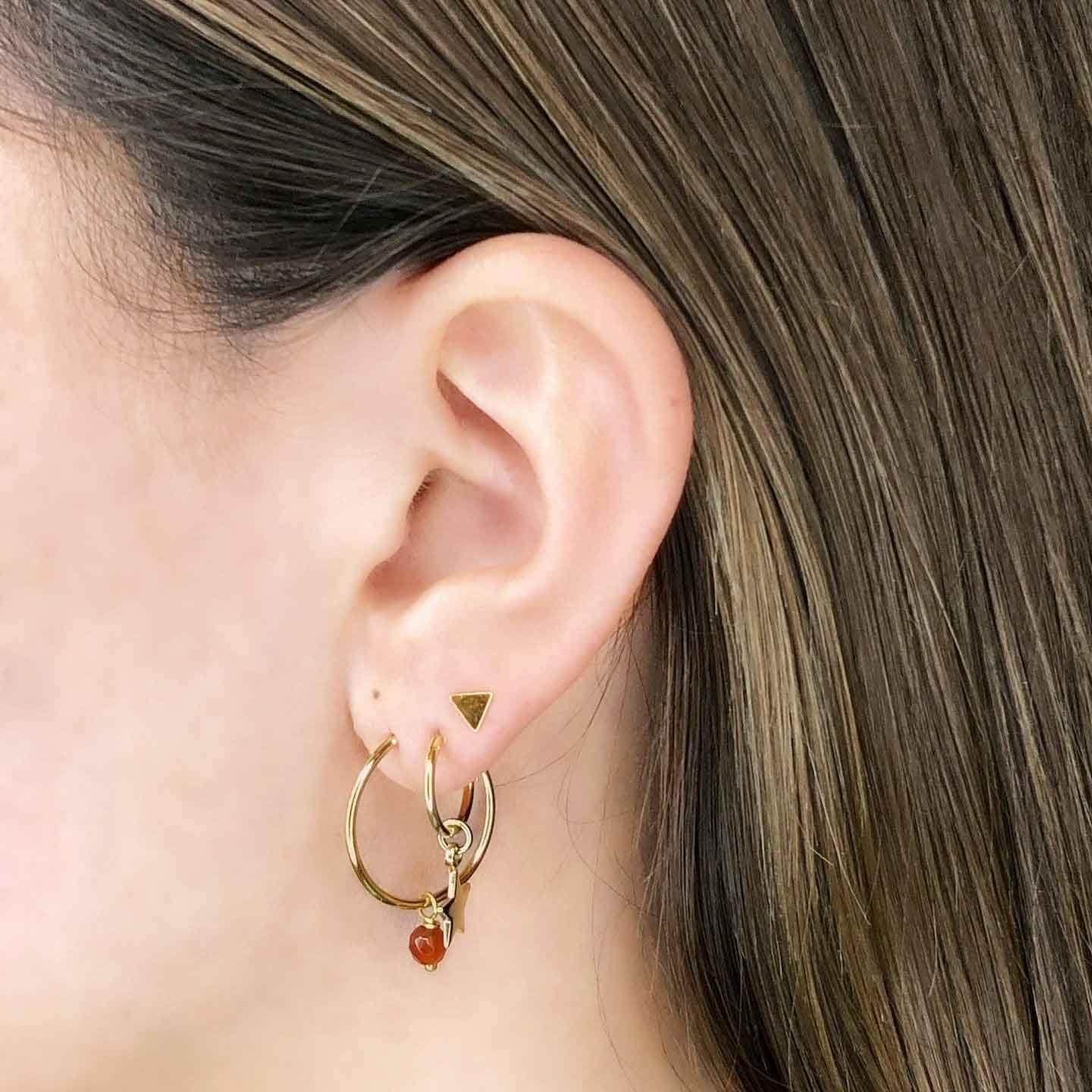 model with Gold Plated Hoop Earrings with Red Stone